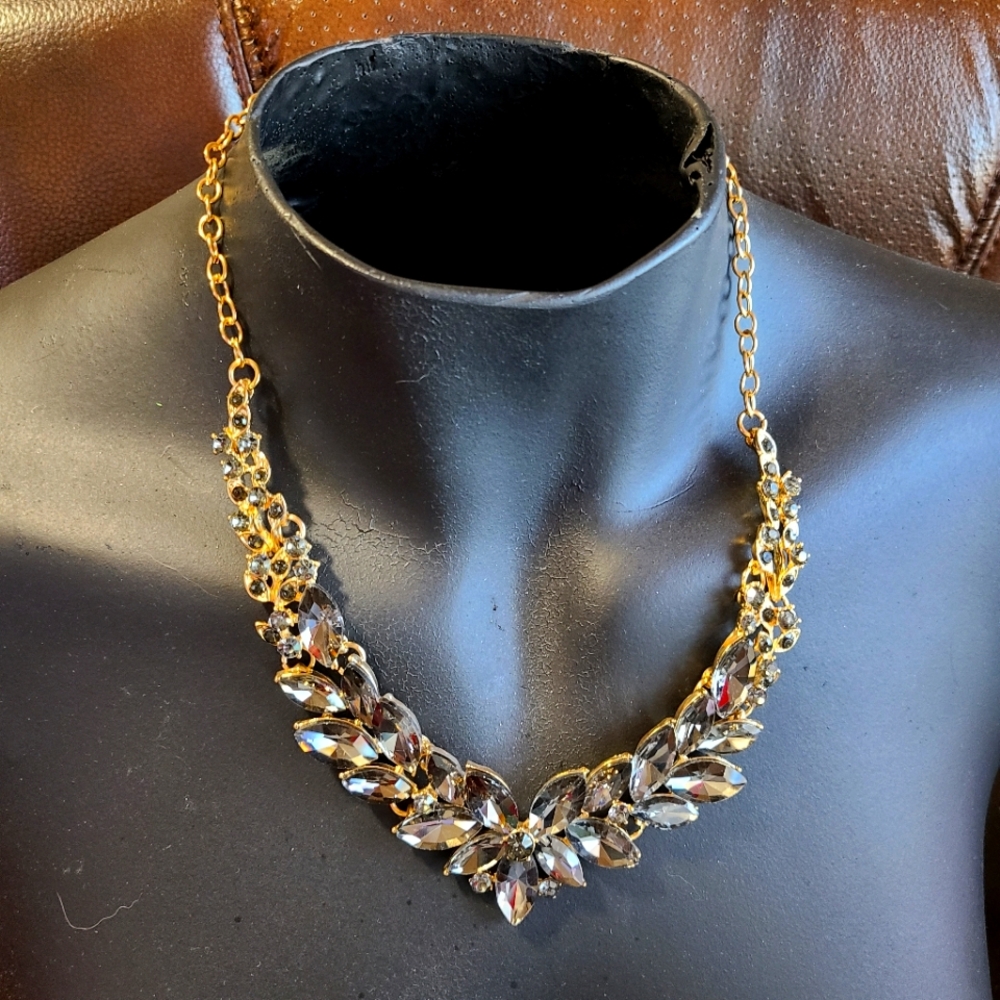 Sparkling Black Rhinestone Bib On Gold Embossed Necklace.